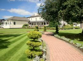 Thornton Hall Hotel & Spa，位于赫斯沃尔的带按摩浴缸的酒店