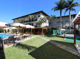 Hotel Ilhas do Caribe - Na melhor região da Praia da Enseada，位于瓜鲁雅Enseada的酒店