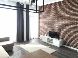 GIA Suites，位于Caracal的带停车场的酒店