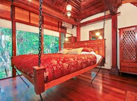 Wollumbin Palms Rainforest Retreat，位于Uki沃尔宁山国家公园附近的酒店