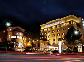 新东海旅游酒店，位于东海市东海健康休闲运动城附近的酒店