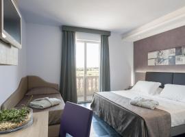 乐敦套房酒店，位于切萨雷奥港的海滩酒店