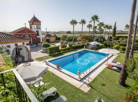 Casa de Campo con Piscina en Sevilla en los Palacios y Villafranca，位于洛斯帕拉西奥西维利亚夫兰卡的酒店