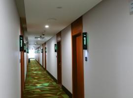 青皮树上海金山区金山国际商贸城卫宏路酒店，位于Beicang的酒店