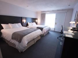 德斯艾斯科尔斯酒店，位于Amos的酒店