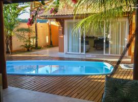 Casa de beira mar com piscina，位于科鲁里皮的海滩酒店