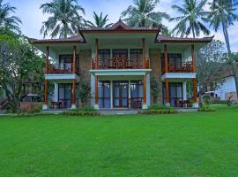 Mangsit Suites by Holiday Resort Lombok，位于芒希的带停车场的酒店