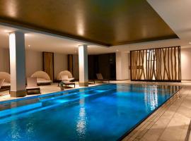 Sunny Suite 14 - charmant und elegant mit Pool und Saunabereich，位于伯尔格伦德-雷特维施的酒店