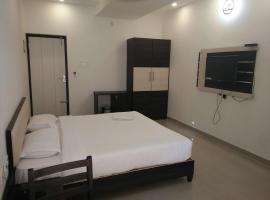 Hotel Ambai Grand，位于Ambāsamudram的酒店