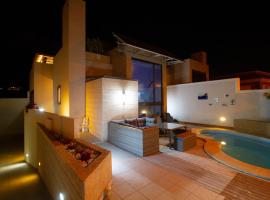 MEDANO4YOU Casa Violeta，位于厄尔梅达诺的带按摩浴缸的酒店