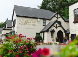 阿尔罗小屋酒店，位于Aherlow巴利基斯廷乡村高尔夫俱乐部附近的酒店