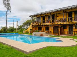 Hostería Colibri Aeropuerto，位于塔巴贝拉的酒店