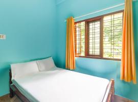 SPOT ON 46011 Vadakkekarayil Tourist Home，位于蒙纳的酒店