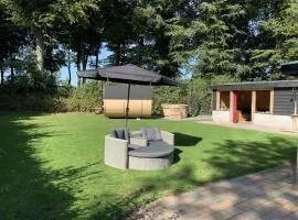 Holiday home with covered porch and sauna