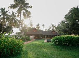 Vismaya Lake Heritage，位于Turavūr瓦伊科姆大天寺附近的酒店