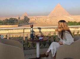 Sphinx palace pyramids view，位于开罗的酒店