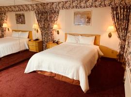 Coliseum Inn & Suites - Garden City Long Island，位于East Meadow的酒店