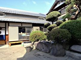 ゲストハウス喜平，位于贝冢市Kishiwada Castle附近的酒店