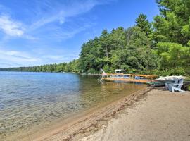 Panther Pond Cabin with 200 Ft Sand Beach and Dock!，位于Raymond的酒店