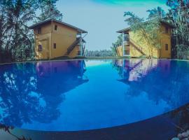 Amri River Cottages And Ayurvedee Retreat，位于本托塔的酒店