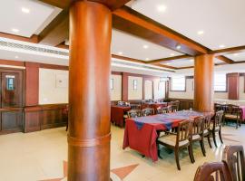 Capital O 70077 Vijaya Palace，位于奎隆的酒店