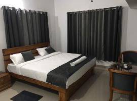 KK Group Of Residency, Virajpet,Coorg，位于马迪凯里的酒店