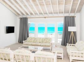 Beachfront White Palm Villa- Tar Bay, Great Exuma，位于Rokers Point Settlement的度假屋