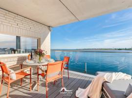 Horizont- direkt am Wasser, Hafenblick, Fahrstuhl, Sauna, ueberdachter Balkon，位于奥尔本尼兹的酒店