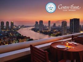 是隆中央酒店，位于曼谷河滨区的酒店