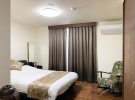 Shirokane Freeport Hotel - Vacation STAY 84162，位于上富良野町的酒店