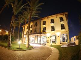 拉穆尼亚酒店，位于特拉布洛斯黎波里奥林匹克体育场附近的酒店