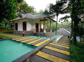 OYO 10233 Century Village Resort，位于玛纳多迪的酒店