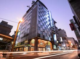 奇异果快捷旅店成功店，位于台中市的酒店