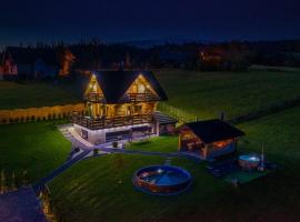 Domek w górach DeLuxe sauna,jacuzzi,basen,hot tub-Nowy Targ blisko Białka ,Zakopane，位于新塔尔格的酒店