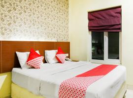 Vaccinated Staff - Capital O 454 Raising Hotel，位于马卡萨的酒店