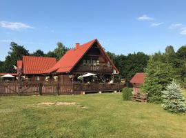 Agroturystyka FIFI Dom drewniany z 4 sypialniami，位于Młynary的酒店