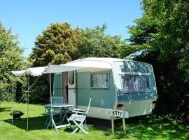 KItty unique 60s caravan set in pretty garden