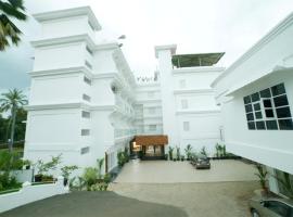 Hotel Surya iritty, near iritty bridge, kannur, kerala，位于坎努尔的酒店