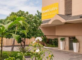 BloomSuites l Ahmedabad，位于艾哈迈达巴德National Institute of Pharmaceutical Education and Research附近的酒店