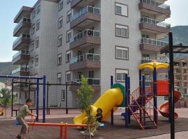 Oz Ulutas Apart Evleri，位于菲尼凯的海滩短租房