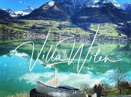 Luxury loft on top of Villa Wilen with tremendous views by the lake，位于萨尔嫩的酒店