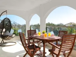 House of Paradise in front of the golf court-sea