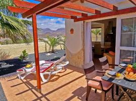 Ferienhaus Casa Oasis - La Pared - Garten - Meerblick，位于拉帕拉德的酒店