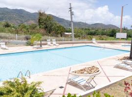 Apartment in Villas Del Faro Resort with WIFI，位于毛纳沃的海滩短租房