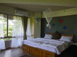 Capital O 79978 Rustic Charm Wayanad，位于Chekadi的酒店