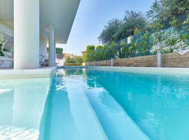 ApartmentsGarda - Le Terrazze Del Garda Residence，位于拉齐塞的酒店