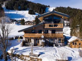 Ski in - Ski out Panoramaferienhaus Breitmoos neben Mittelstation，位于米特西尔的酒店