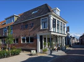 Fietshotel Zee van Tijd Holwerd，位于霍尔沃德的酒店