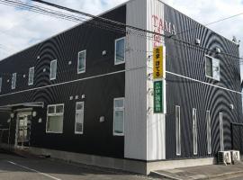 多摩经济型酒店，位于石卷市的酒店