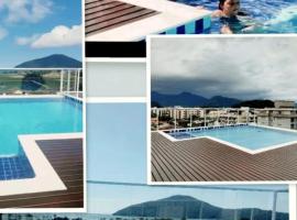 APARTAMENTO PRÓXIMO A PRAIA PISCINA E AREA GOURMET